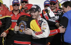 Brad Keselowski hugs his Nationwide owner, Dale Jr. in Victory Lane